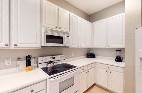 Bahama Bay Condo | 1st floor condo w/gym, restaurant, sauna, tennis court, limited-mobility access
