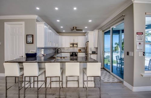 Mid Island House | 251 Key West Court: HUGE Luxe Beachfront Pool Home Steps from the Sand