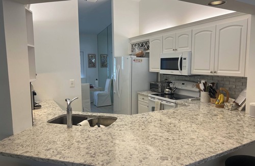 Pelican Bay Condo | 3 BR coach house at The Barrington Club in Pelican Bay. Private beach access.