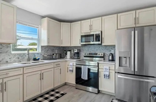 Riviera Beach House | 4-bedroom house in charming Riviera Beach with WiFi, AC. Relax and unwind
