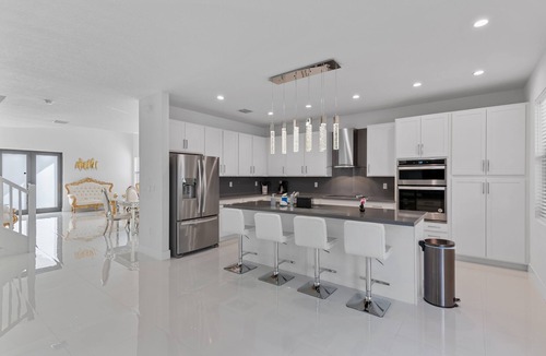 Ludlam Villa | 4BR/4BTH Miami Oasis: Stylish Retreat w/BBQ & Trampoline - Near Beach & Airport