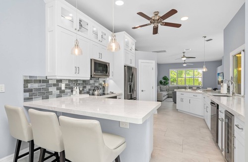 Naples House | A NAPLES STUNNER! HIGHLY Sought 3/2 Pool/Spa/Lake Home, Fully Stocked, New Furn.