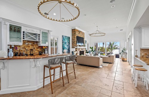 Boynton Beach Villa | A waterfront oasis with soft white sand beach, pool and intracoastal dock views.
