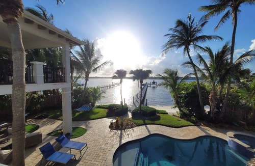 Boynton Beach Villa | A waterfront oasis with soft white sand beach, pool and intracoastal dock views.