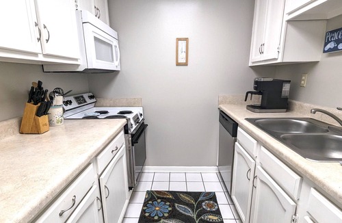 Avon By The Sea Condo | Affordable ONE BR Main Floor Condo RIGHT ON THE BEACH w/KING Bed & Heated POOL!