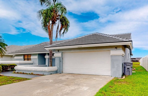 Boynton Beach House | Airy home with pond views, private pool, game room, and dog-friendly