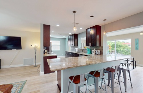 Palm City House | Angler's oasis with dock, boat lift, river views, hot tub, & furnished patio