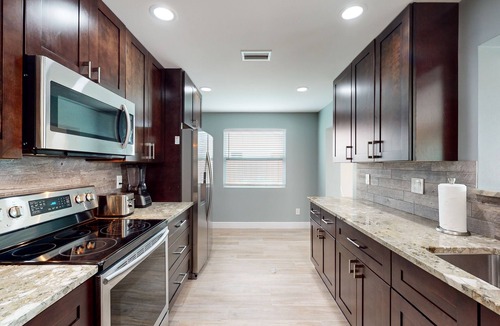 Palm City House | Angler's oasis with dock, boat lift, river views, hot tub, & furnished patio