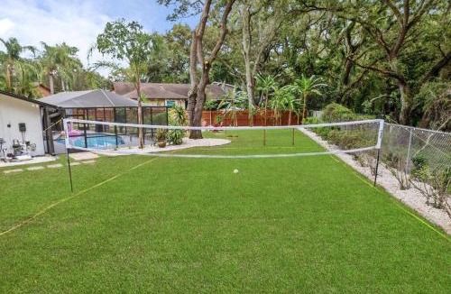Palm Harbor House | Backyard Games, Fire Pit, Heated Pool, Near Beach