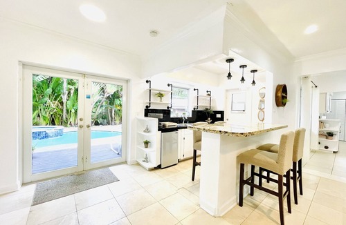 Dolphin Isles House | Bamboo House, Heated pool, Steps from the beach.