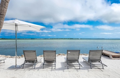 Breezeswept Beach Estates House | Beach Haven: Modern 4-Bed/2-Bath Single Family Home with Breathtaking Open Water