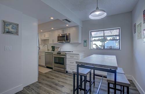 Bradenton Beach Condo | Beach Palms 7A-Beach 1 Minute Walk-Heated Pool-Free Wi-Fi-Dock-Surrounded By Wat