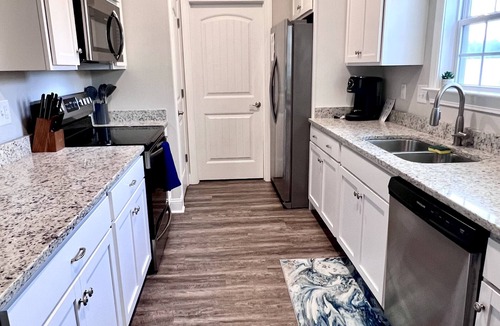 Conway House | Beach Vacation Made Easy Spacious Yard Relaxing Porch Close to Everything
