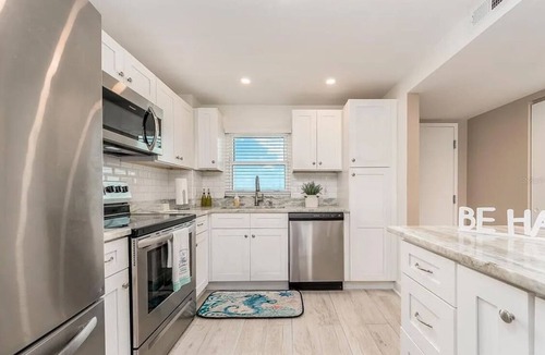 Sand Key Condo | Beachfront living experience! Enjoy amazing sunsets and views.