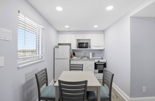 Ormond Beach Apartment | Beachfront Studio | Kitchen + Pool & Picnic Area