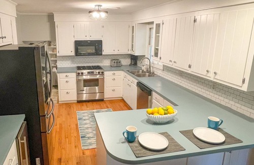 Isle of Palms House | Beachy haven with a beautiful screened in porch and big yard