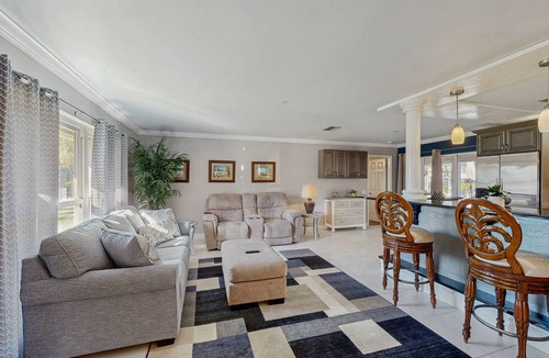 Lochmoor Waterway Estates House | Beautiful, dog-friendly home with in ground pool, putting green & sundeck