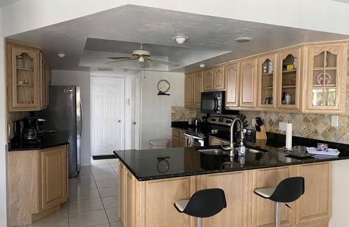 Pelican Villa | Beautiful Gulf access canal views with heated pool.