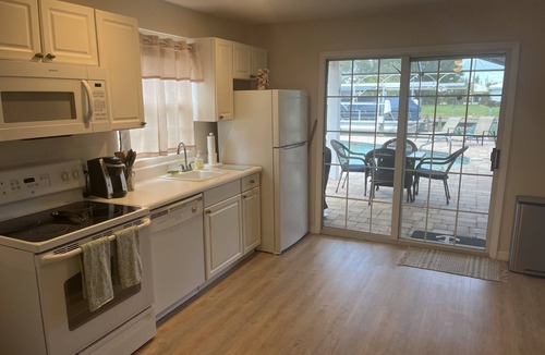 Bokeelia Apartment | Beautiful pool home on canal with 45-foot boat dock. 10 minutes to Gulf by boat.