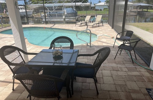 Bokeelia Apartment | Beautiful pool home on canal with 45-foot boat dock. 10 minutes to Gulf by boat.