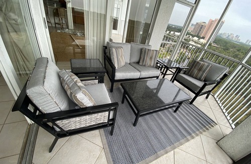 Pelican Bay Condo | Beautiful sunset views of the Gulf from this western facing 9th floor condo.