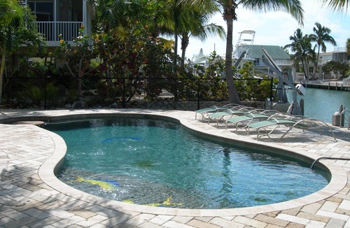Venetian Shores Villa | Beautiful Venetian Shores, Cozy home, Heated pool, Tiki, Boat Lift, Fish & Dive.