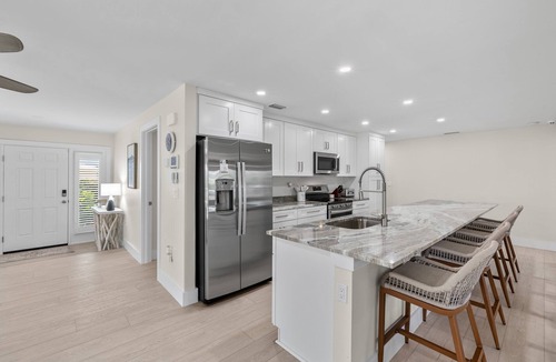 Shell Harbor House | Beautifully newly redesigned canal front pool home minutes to beach! NEW!
