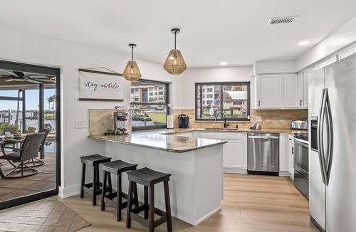 Caloosahatchee House | Best Home in the Cape! Brand New Remodel! - River View! - Tiki Hut on the Water!