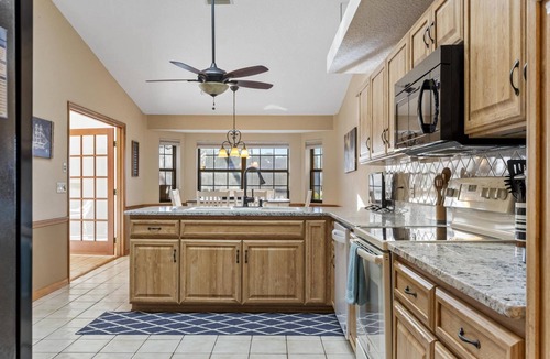 Palm Harbor House | Blue Haven Large Waterfront Pool Home | Boat Dock | Canal | Water Views | Pool Bar | WIFI | Fishing