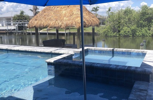 South Gulf Cove House | Brand New Luxury One Of A Kind Waterfront Home With Pool, Spa & Tiki Hut!