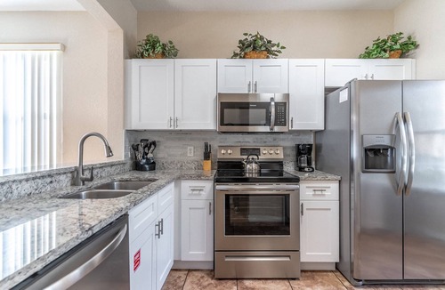 Wellington House | Bright 4BR Townhome | Regal Palms Resort w/Pools, Clubhouse & Fun | Near Disney