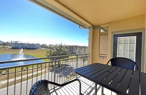 Regal Palms Condo | Bright condo with south facing balcony overlooking pond