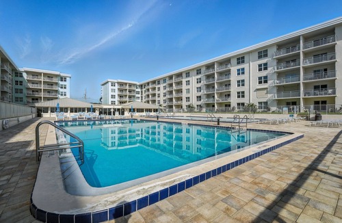 New Smyrna Beach Condo | Bright oceanfront corner condo with beach/pool views, large balcony, and multiple pools
