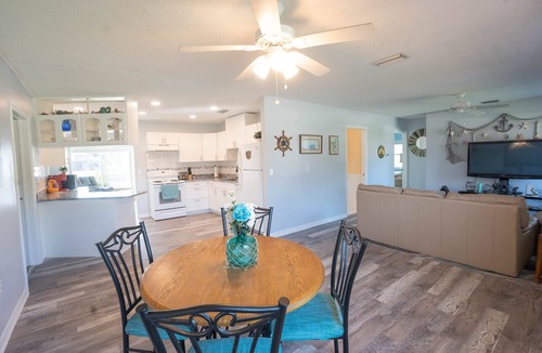 Gulf Cove House | Bright Waterfront Home. Heated Pool. Short drive to Beach. Beautiful Sunsets.