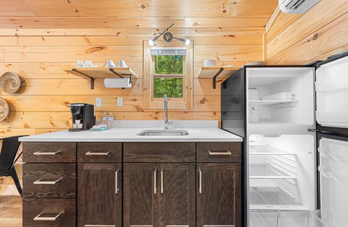 Hartwell RV Rental | Cabin #8: Studio style layout with kitchenette and a large gravel parking pad beside the cabin for easy boat or trailer storage.