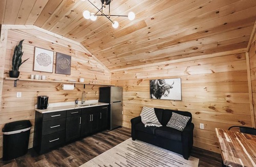 Hartwell RV Rental | Cabin #9: One king-size bed, a kitchenette, and a large gravel parking pad beside the cabin for easy boat or trailer storage.