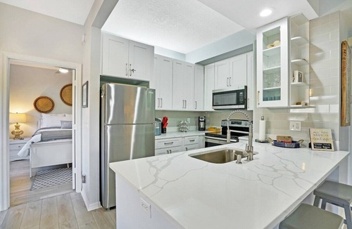 Bella Vista Condo | Carlin Park Villa,Pool,Pets OK-Walk to the Beach!