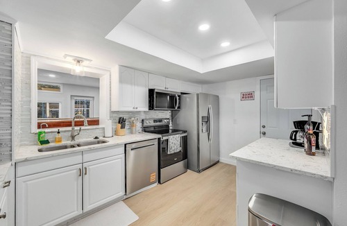 Hampton Homes House | Casa Las Olas - Waterfront Home with Heated Pool, Movie Theater & Arcade