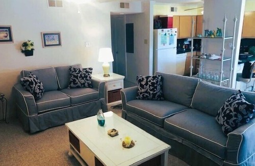 North Ocean City Condo | Charming 2 bed 2 bath condo featuring the ultimate private setting with wooded views that you can enjoy from your spacious deck.