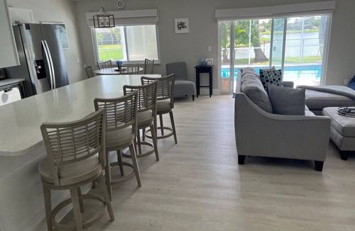Jupiter Village House | Charming 3-bedroom pool home on the lake with spectacular sunsets & close to all