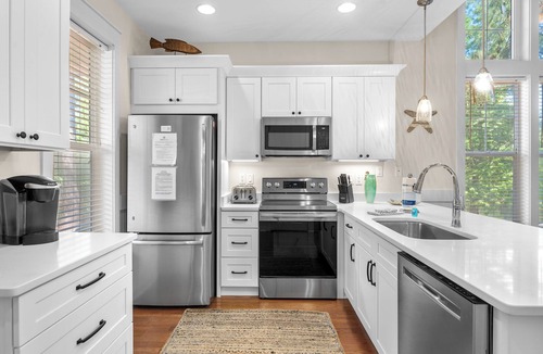 Laurel Grove House | Charming Beach Cottage w/2 GOLF CARTS! Pool, Hot Tub, Beach Tram, Near Wharf