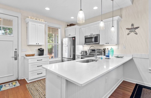 Laurel Grove House | Charming Beach Cottage w/2 GOLF CARTS! Pool, Hot Tub, Beach Tram, Near Wharf
