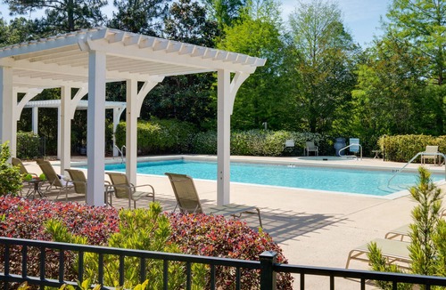 Laurel Grove House | Charming Cottage w/Lake Views, Golf Cart, Beach Tram, Tropical Pool, Hot Tub.