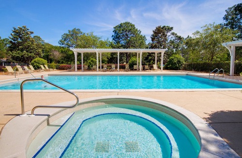 Laurel Grove House | Charming Cottage w/Lake Views, Golf Cart, Beach Tram, Tropical Pool, Hot Tub.