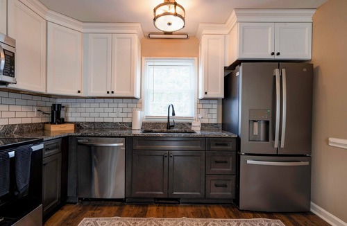 Crouse House | Charming house in a golf course community with lake views and a big yard.