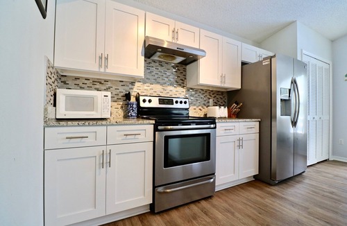 Lindfields House | Chic 4-Bedroom Home w/Pool, Lake View, & Games Room - Minutes from Disney