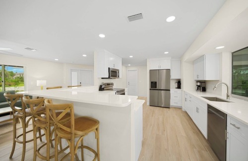 Shell Harbor House | Coastal Charm: Pool Home on Canal on East End!