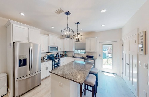 Holiday Beach House | Coastal-chic escape with bikes, enclosed backyard/shaded patio & Big Green Egg