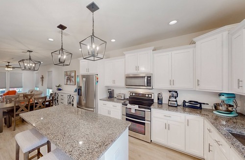 Holiday Beach House | Coastal-chic escape with bikes, enclosed backyard/shaded patio & Big Green Egg