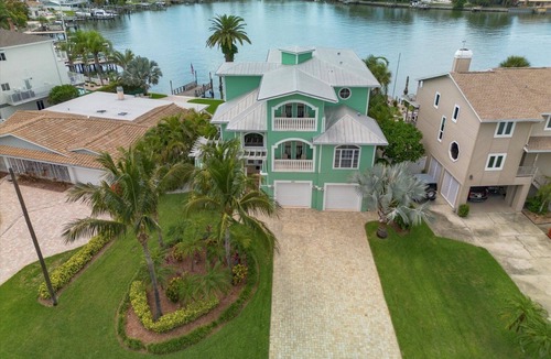 Indian Rocks Beach House | Coastal Elegance: Retreat with Heated Pool, Golf Cart, and Entertainment Haven